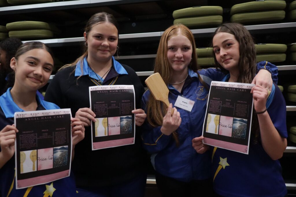 Year 9 students at Redbank Plains State High School showcasing their product, 'Angel Hair Care'.